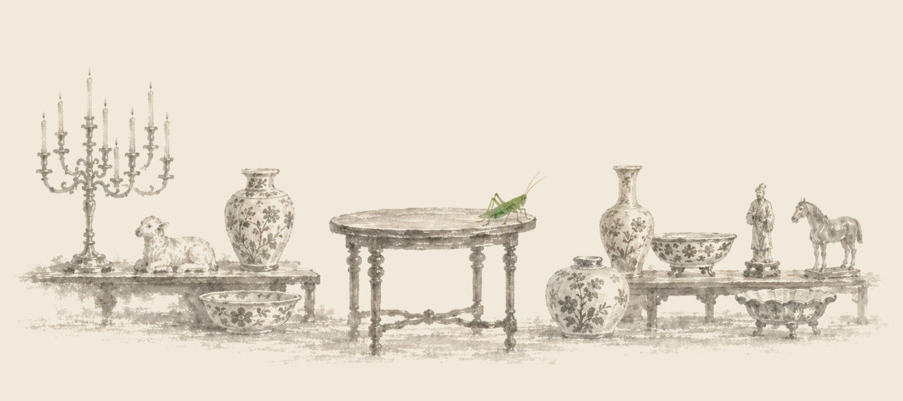 A green grasshopper stands on a small round table among vases, bowls, a candelabra with ten candles, and small figures of a lamb, a man and a horse.