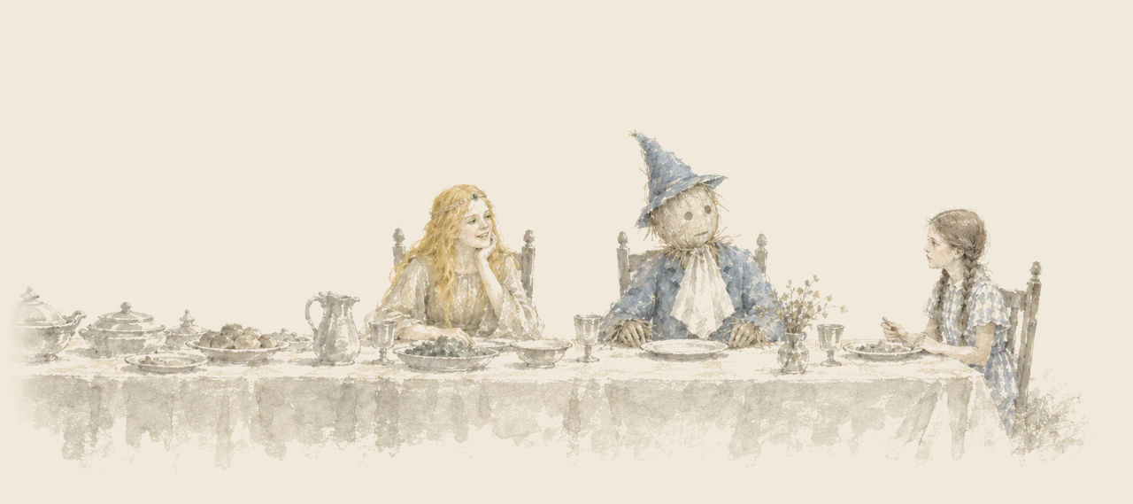 Ozma laughs at the head of a long laid dinner table, with the Scarecrow beside her before an empty plate and Dorothy across from him.