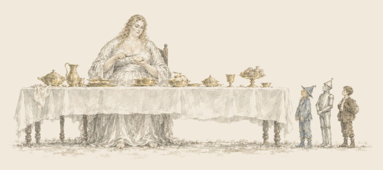 Mrs. Yoop, the Giantess, sits at a long table of golden dishes buttering a biscuit, as the Scarecrow, the Tin Woodman and Woot look up at her.